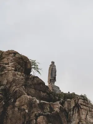 a statue on the side of a mountain at Stylish 1BD - Free Private Garage in Plovdiv