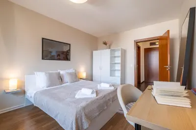 a bedroom with a bed and a table and a desk at City Oasis: Stylish Retreat in the Heart of Sofia in Sofia