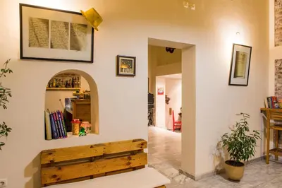 a room with a wall with a wooden bench at Villa 