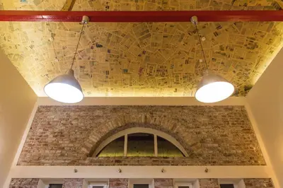 a mural on the ceiling of a building with two lights at Villa 