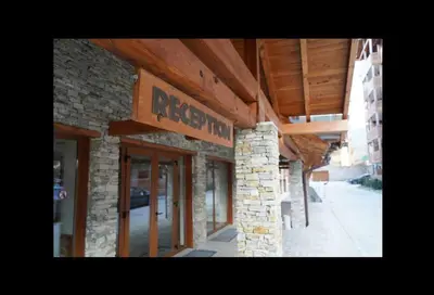 a brick building with a sign that reads ragged at Best Mountain View Chalet in Bansko