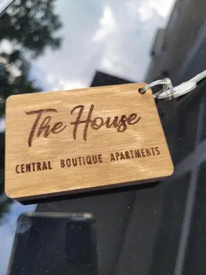 a wooden tag on the window of a car at The House - Central Boutique Apartments in Kyustendil