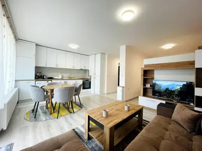 a living room with a couch and a table at Katerina Apartments in Velingrad