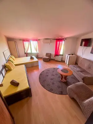 a living room with a couch and a table at ТРАКАРТ-ПАРК in Plovdiv