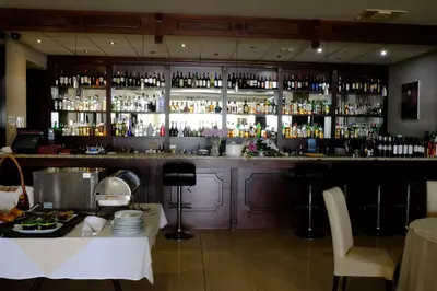 a bar with a lot of bottles of alcohol at Hotel Dragalevtsi in Sofia