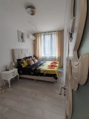 a bedroom with a bed and a window at Gold Infinity in Velingrad