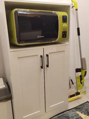 a microwave sitting on top of a white cabinet at Gold Infinity in Velingrad