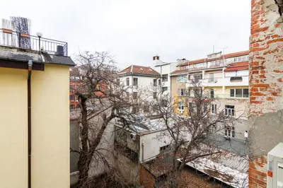 a view of a city with buildings and a tree at Viral 2 BR Photo Studio Loft in Sofia