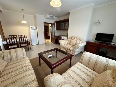 a living room with two couches and a coffee table at Downtown apartments in Bansko