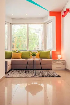 a living room with a couch and a table at BohoBox Studios in Plovdiv