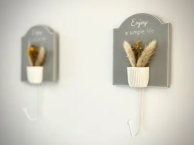 a sign that says enjoy a simple life with a plant at Central Sofia Condo in Sofia