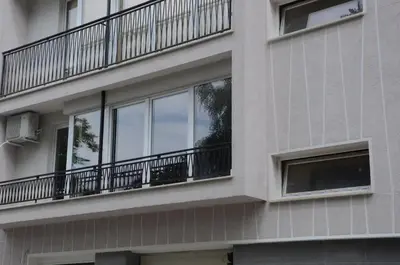 an apartment building with windows and a balcony at Industrial Look Apartment Top Centre + Free Parking in Sofia