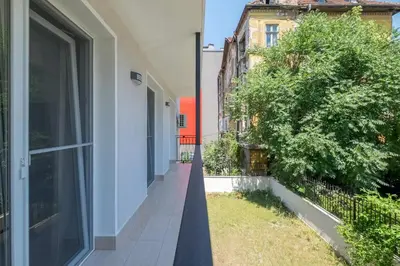 an empty balcony of a building with a large window at Quiet & airy modern apt. Top Centre Free Parking in Sofia