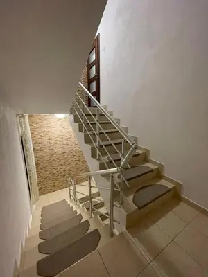 a staircase in a house with a stair case at Апартамент Никола и Мария in Sapareva Banya