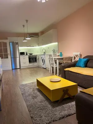 a living room with a couch and a table at Guest House Amaya River in Plovdiv