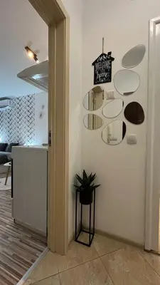a room with a white wall with circular shelves at Studio John's in Blagoevgrad