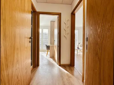 a hallway with a door open to a room at Apart-Hotels-Sofia, AHS in Sofia
