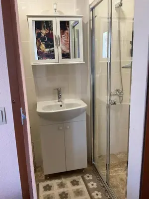 a bathroom with a sink and a shower at Three Graces in Banya