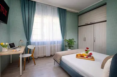 a hotel room with a bed with a tray of fruit on it at Free Parkingand Relax in Sofia