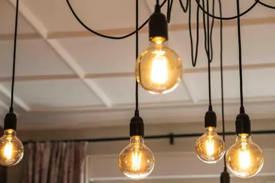 a group of light bulbs hanging from a ceiling at Heart of the Center, 2Bedroom View Lux Apartment in Sofia