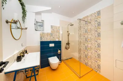 a bathroom with a toilet and a shower at Heart of the Center, 2Bedroom View Lux Apartment in Sofia