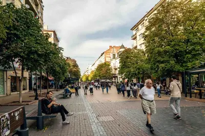 a group of people walking down a city street at Heart of the Center, 2Bedroom View Lux Apartment in Sofia
