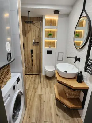 a bathroom with a sink and a washing machine at Pine & Wine Bathtub Apartment in Pamporovo