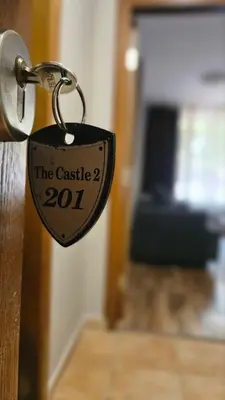 a lock on a door that says the castle at Minkov Apartments, Пампорово - Замъка 2 in Pamporovo