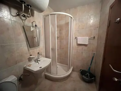 a bathroom with a shower and a sink and a toilet at Minkov Apartments, Пампорово - Замъка 2 in Pamporovo