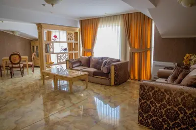 a living room with a couch and a table at Luxury Apartment Rich 2 in Velingrad