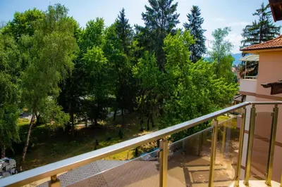 a view from the balcony of a house with trees at Luxury Apartment Rich 2 in Velingrad