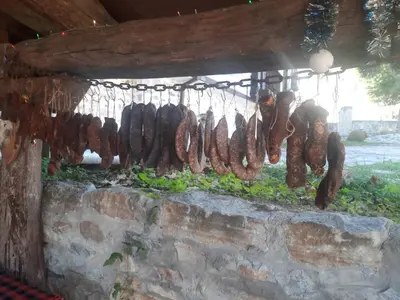 a bunch of sausages hanging on a wall at Парк - Хотел Макензен in Melnik
