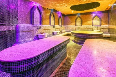 a bathroom with purple lighting and sinks and toilets at Terra complex -D6 - Balkan private apartment-Spa Sking Golf and Relax in Razlog