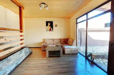 a living room with a couch and a table at Етно комплекс 