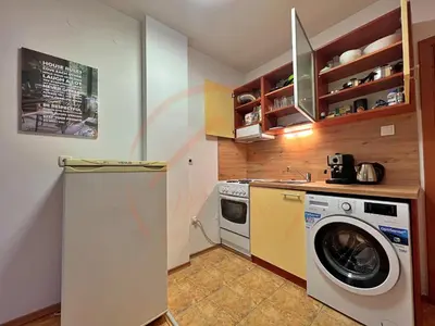 a kitchen with a washer and a washing machine at Tranquil Retreat in the Heart of Sofia: 2BR in Sofia