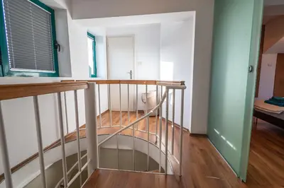 a spiral staircase in a room with a hallway at On the top! in Sofia