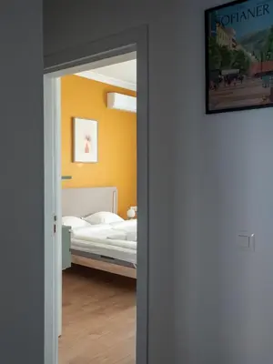 a door leading into a bedroom with a bed at Central Apartment Parking Two Bedrooms Sky Terrace in Sofia