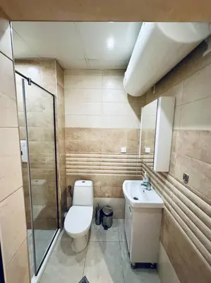 a bathroom with a toilet and a sink and a shower at Barbie Studio in Sofia