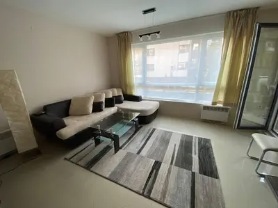 a living room with a couch and a table at Lovely 1-bedroom appartment in Sofia near Vitosha in Sofia