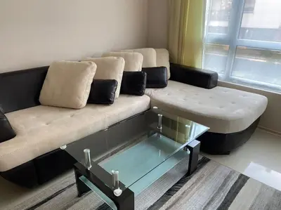 a living room with a couch and a coffee table at Lovely 1-bedroom appartment in Sofia near Vitosha in Sofia