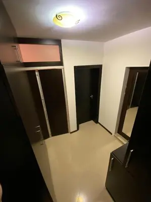 a room with a hallway with two doors and a light at Lovely 1-bedroom appartment in Sofia near Vitosha in Sofia