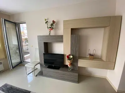 a living room with a fireplace with a tv at Lovely 1-bedroom appartment in Sofia near Vitosha in Sofia
