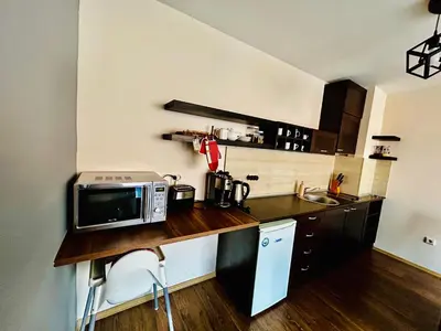 a kitchen with a counter with a microwave on it at Bansko Royal Towers Private Apartment V&K in Bansko