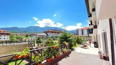 a balcony with a view of a city at ALTITUDE MOUNTAIN APARTMENTS ASPEN at GONDOLA BANSKO in Bansko