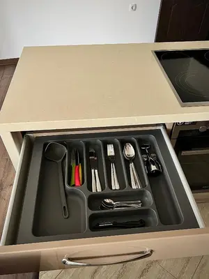 a drawer in a kitchen with utensils in it at Ultra Lux Apartment Free Underground Secure Parking in Pazardzhik