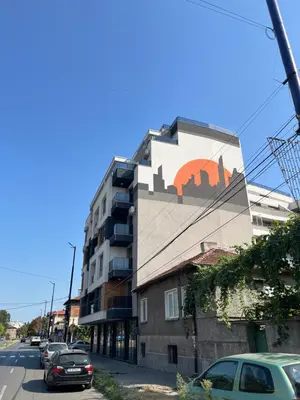 a building with a mural on the side of it at Ultra Lux Apartment Free Underground Secure Parking in Pazardzhik