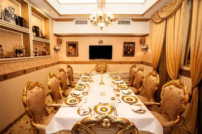 a large dining room with a long table and chairs at Hotel Boyana in Sofia