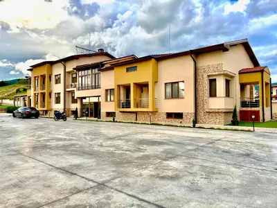 a parking lot in front of a building at Hani Guest House in Garmen