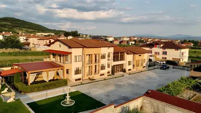 an aerial view of a building in a city at Hani Guest House in Garmen