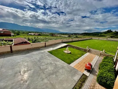an aerial view of a yard with a field of grass at Hani Guest House in Garmen